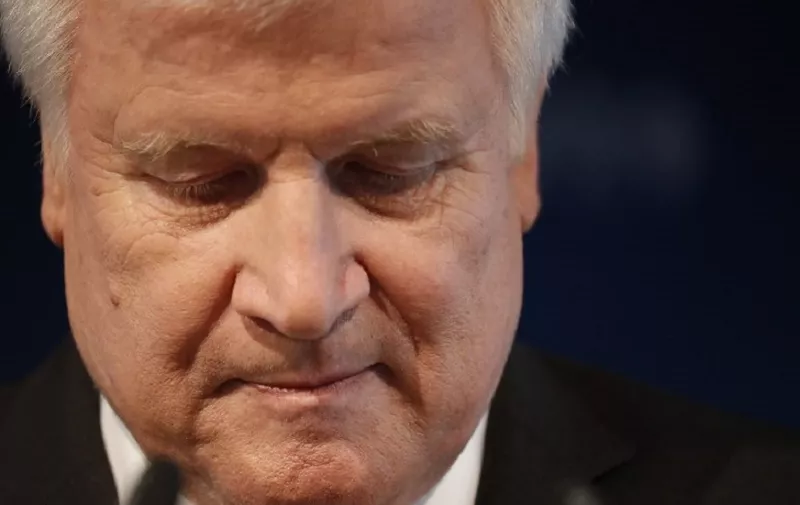 (FILES) In this file photo taken on October 15, 2018 German Interior Minister and conservative Christian Social Union (CSU) party leader, Horst Seehofer gives a press statement after a CSU leadership meeting in Munich, southern Germany, one day after state elections in Bavaria. - Seehofer intends to step down in 2019 as leader of the conservative CSU following recent election results he said at a meeting of the party leadership in Munich on November 11, 2018. (Photo by Odd ANDERSEN / AFP)