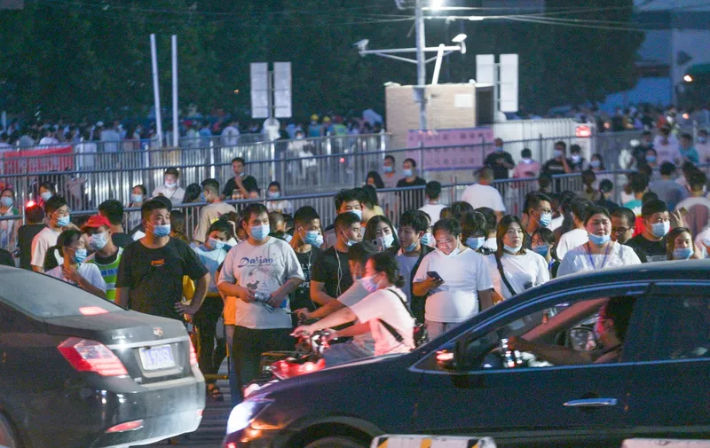 Thousands of workers get off work at Foxconn in Zhengzhou city, central China's Henan province, 15 September 2021.,Image: 632482095, License: Rights-managed, Restrictions: , Model Release: no