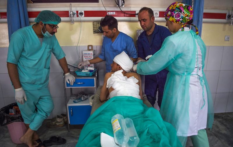A wounded man receives treatment at the Wazir Akbar Khan hospital following three blasts in Kabul on July 25, 2019. - At least seven people were killed and 21 wounded by three blasts that rocked the Afghan capital on July 25 ahead of the election season. (Photo by WAKIL KOHSAR / AFP)
