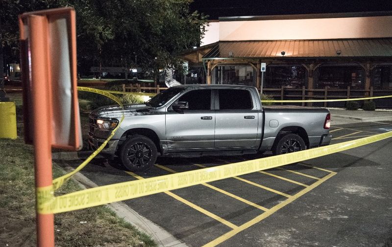 ODESSA, TEXAS - AUGUST 31: Police tape marks the scene outside a Twin Peaks restaurant after multiple people were shot on August 31, 2019 in Odessa, Texas. Officials say an unidentified suspect was shot and killed after killing 5 people and injuring 21 in Odessa and nearby Midland.   Cengiz Yar/Getty Images/AFP