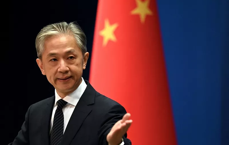 Chinese Foreign Ministry spokesman Wang Wenbin gestures during a press conference at the Ministry of Foreign Affairs in Beijing on August 8, 2022. (Photo by Noel Celis / AFP)
