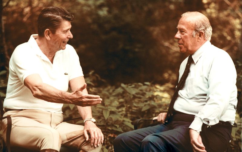 Jun 26, 1982 - Thurmont, Maryland, USA - United States President RONALD REAGAN, left, speaks with United States Secretary of State-designate GEORGE P. SHULTZ at Camp David, the presidential retreat.  Shultz was named to replace United States Secretary of State Haig who resigned over policy differences within the Reagan Administration.,Image: 566124302, License: Rights-managed, Restrictions: , Model Release: no