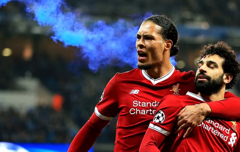 Mohamed Salah of Liverpool celebrates with Virgil van Dijk as a blue flare is thrown on to the pitch by the Liverpool fans Manchester City v Liverpool, UK &#8211; 11 Apr 2018, Image: 368202273, License: Rights-managed, Restrictions: Editorial use only. No merchandising. For Football images FA and Premier League restrictions apply inc. no internet/mobile usage [&hellip;]
