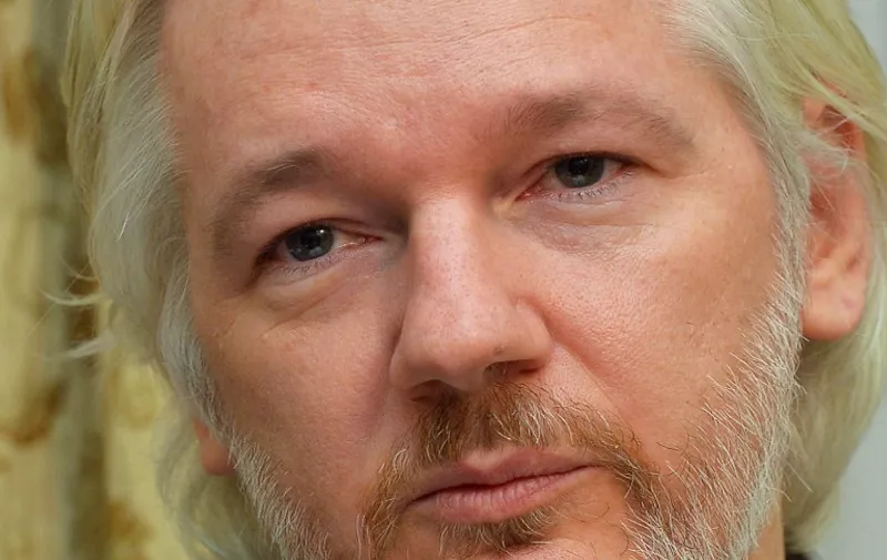 FILES - Picture taken on August 18, 2014, shows WikiLeaks founder Julian Assange during a press conference inside the Ecuadorian Embassy in London where Assange has been holed up for two years. Swedish prosecutors said on August 13, 2015 they had dropped a sexual assault probe against Julian Assange because the time limit on the case had expired. AFP PHOTO / JOHN STILLWELL