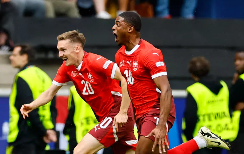 Soccer Football - Euro 2024 - Group A - Hungary v Switzerland - Cologne Stadium, Cologne, Germany - June 15, 2024 Switzerland's Kwadwo Duah celebrates scoring their first goal with Michel Aebischer REUTERS/Wolfgang Rattay