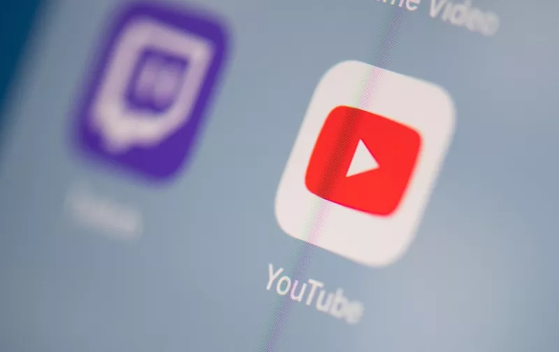 This illustration picture taken on July 24, 2019 in Paris shows the logo of the US Youtube logo application on the screen of a tablet. (Photo by Martin BUREAU / AFP)