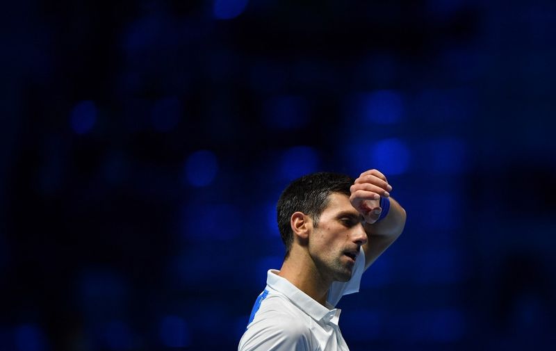 Serbia's Novak Djokovic reacts during his semi-final match of the ATP Finals against Germany's Alexander Zverev at the Pala Alpitour venue in Turin on November 20, 2021. (Photo by Marco BERTORELLO / AFP)