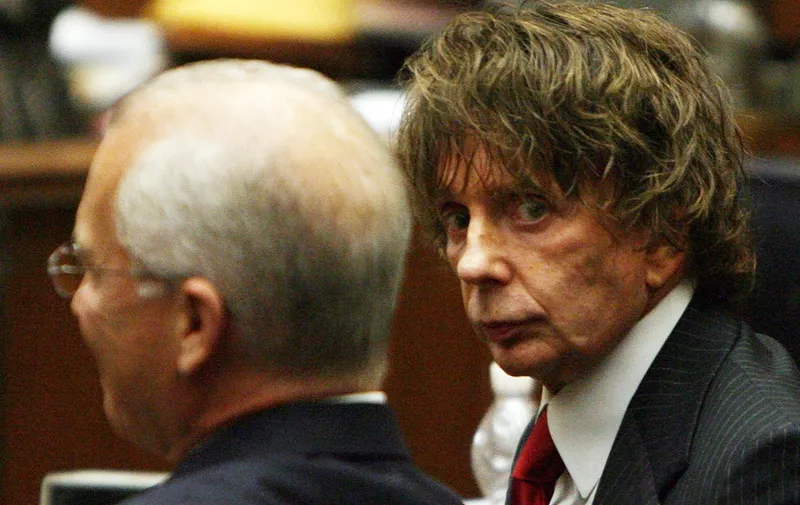 (FILES) In this file photo music producer Phil Spector(R) is seen with his attorney Roger Rosen during his murder trial at the Los Angeles Superior Court in Los Angeles on September 18, 2007. - Phil Spector, who revolutionized 1960s pop music but ended up in prison for murder, has died, authorities said on January 17, 2021. Spector was pronounced dead on Saturday and his "official cause of death will be determined by the medical examiner," according to a statement from the California Department of Corrections and Rehabilitation. (Photo by Gabriel BOUYS / POOL / AFP)
