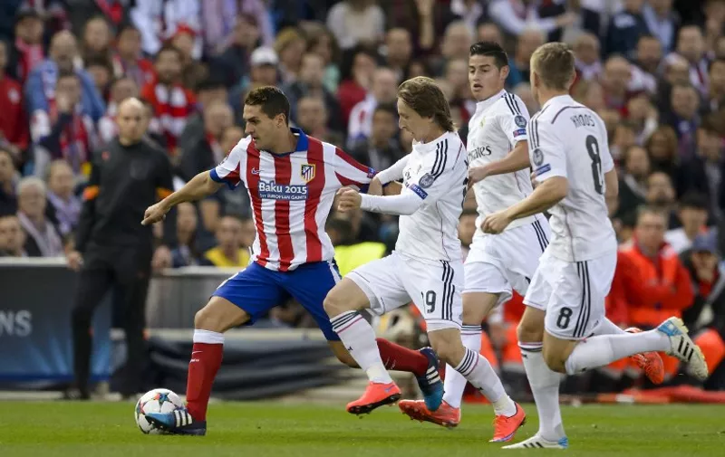 Atletico Madrid&#8217;s midfielder Koke (L) vies with Real Madrid&#8217;s Croatian midfielder Luka Modric (2nd L), Real Madrid&#8217;s Colombian midfielder James Rodriguez (2nd R) and Real Madrid&#8217;s German midfielder Toni Kroos during the UEFA Champions League quarter final football match Atletico de Madrid vs Real Madrid CF at the Vicente Calderon stadium in Madrid on April [&hellip;]