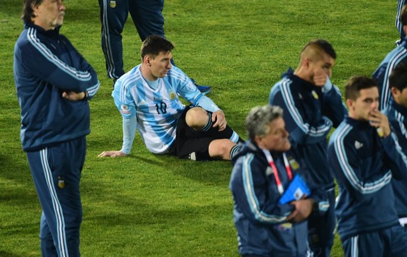 Argentina's forward Lionel Messi reacts in dejection after the 2015 Copa America final football match penalty shootout against Chile, in Santiago, Chile, on July 4, 2015. Chile won by 4-1 (0-0).  AFP PHOTO / MARTIN BERNETTI