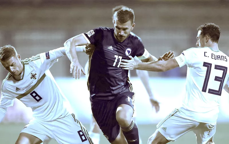 Bosnia and Herzegovina&#8217;s Edin Dzeko (centre) battles for the ball with Northern Ireland&#8217;s Steven Davis (left) and Corry Evans during the Nations League match at The Grbavica Stadium, Sarajevo., Image: 391186994, License: Rights-managed, Restrictions: , Model Release: no, Credit line: Profimedia, Press Association