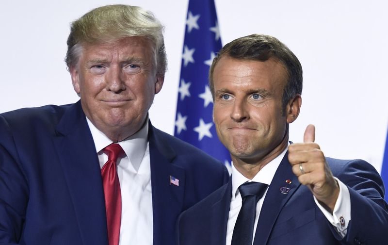 France's President Emmanuel Macron (R) and US President Donald Trump pose during a  joint press conference in Biarritz, south-west France on August 26, 2019, on the third day of the annual G7 Summit attended by the leaders of the world's seven richest democracies, Britain, Canada, France, Germany, Italy, Japan and the United States. (Photo by Bertrand GUAY / AFP)