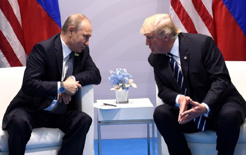 US President Donald Trump and Russia's President Vladimir Putin hold a meeting on the sidelines of the G20 Summit in Hamburg, Germany, on July 7, 2017. / AFP PHOTO / SAUL LOEB