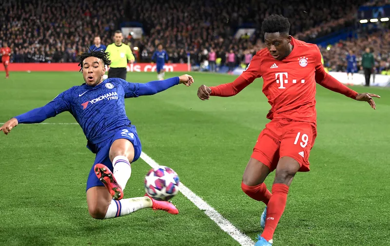 LONDON, ENGLAND - FEBRUARY 25: Alphonso Davies of Bayern Munich crosses under pressure from Reece James of Chelsea  during the UEFA Champions League round of 16 first leg match between Chelsea FC and FC Bayern Muenchen at Stamford Bridge on February 25, 2020 in London, United Kingdom. (Photo by Mike Hewitt/Getty Images)