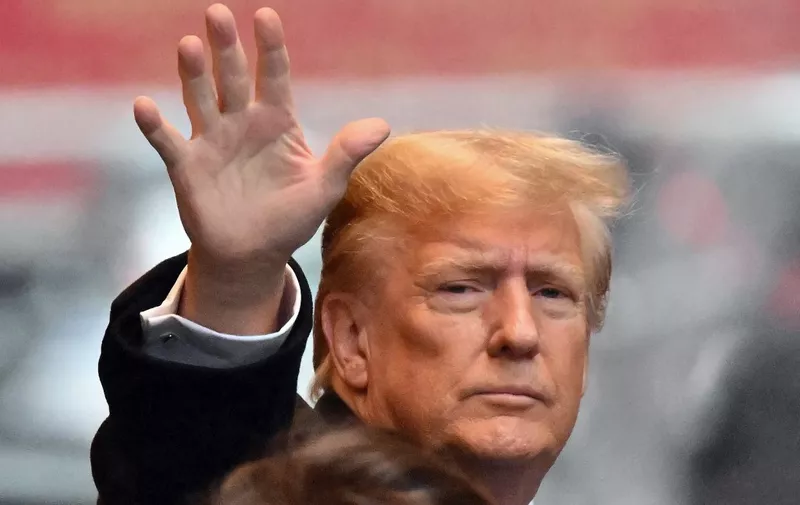 Former US President Donald Trump waves as he departs for his sexual assault defamation trial in New York on January 25, 2024. Trump's trial resumes on Thursday, two days after the Republican primaries in New Hampshire, with the former US president expected to testify. Writer Jean Carroll, 80, is seeking more than $10 million alleging that Trump defamed her when he mocked her sexual assault accusations by saying she "is not my type." (Photo by ANGELA WEISS / AFP)