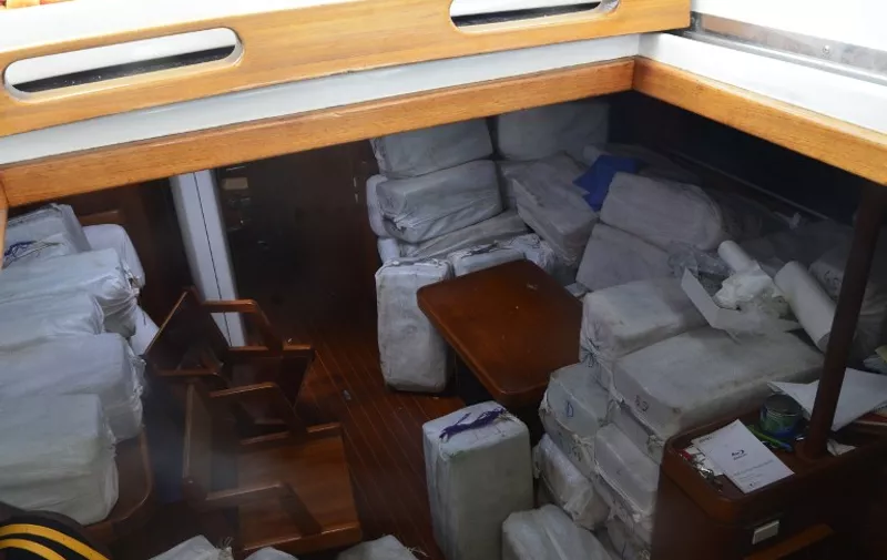 A handout photo taken on April 16, 2015 and released on April 18 by the French customs shows packs of cocaine in the Silandra sailboat seized on April 15 off the French Caribbean island of Martinique. French finance minister Michel Sapin announced on April 18 a record seizure in the boat of 2.25 tonnes, worth 70 millions of euros, during an operation prepared for two years. Three Spanish nationals and a Venezuelan national were arrested on the boat. AFP PHOTO/DOUANE FRANCAISE