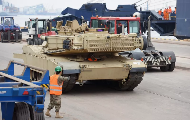 TO GO WITH AFP STORY BY MIKE COLLIER - 
An Abrams tank is seen during delivery in the port of Riga on March 9, 2015. The US delivered over 100 pieces of military equipment to vulnerable NATO-allied Baltic states Monday in a move designed to provide them with the ability to deter potential Russian threats. AFP PHOTO / ILMARS ZNOTINS (Photo by ILMARS ZNOTINS / AFP)