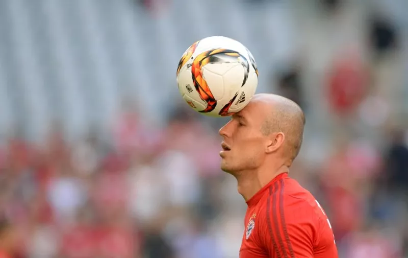 Bayern Munich's Dutch midfielder Arjen Robben juggles with the ball during the warm up ahead the German first division Bundesliga football match Bayern Munich vs Bayer 04 Leverkusen in Munich, southern Germany, on August 29, 2015.  AFP PHOTO / CHRISTOF STACHE

RESTRICTIONS: DURING MATCH TIME: DFL RULES TO LIMIT THE ONLINE USAGE TO 15 PICTURES PER MATCH AND FORBID IMAGE SEQUENCES TO SIMULATE VIDEO. 
== RESTRICTED TO EDITORIAL USE ==
FOR FURTHER QUERIES PLEASE CONTACT DFL DIRECTLY AT + 49 69 650050.