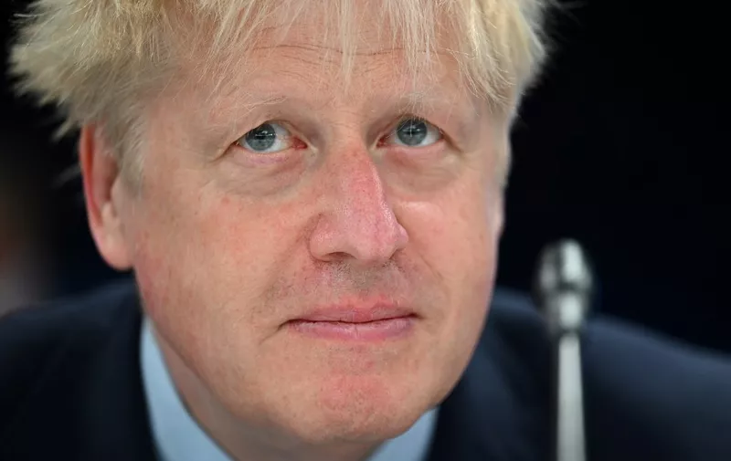 Britain's Prime Minister Boris Johnson looks on ahead of a meeting of The North Atlantic Council during the NATO summit at the Ifema congress centre in Madrid, on June 30, 2022. (Photo by GABRIEL BOUYS / AFP)