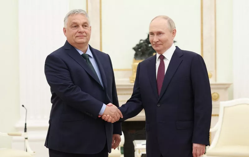 In this pool photograph distributed by the Russian state agency Sputnik, Russia's President Vladimir Putin meets with Hungary's Prime Minister Viktor Orban at the Kremlin in Moscow on July 5, 2024. (Photo by Valery SHARIFULIN / POOL / AFP)