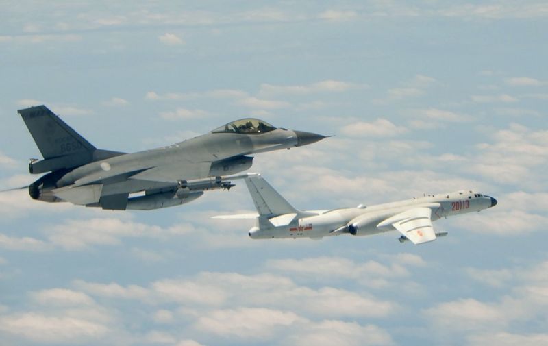 This handout photograph taken and released on May 11, 2018 by Taiwan's Defence Ministry shows a Republic of China (Taiwan) Air Force F-16 fighter aircraft (L) flying alongside a Chinese People's Liberation Army Air Force (PLAAF) H-6K bomber that reportedly flew over the Bashi Channel, south of Taiwan, and over the Miyako Strait, near Japan's Okinawa Island, in a drill. - China sent fighter jets and other military aircraft near Taiwan on May 11 in the latest of a series of drills which Beijing has said are aimed at the island's "independence forces". (Photo by Handout / TAIWAN DEFENCE MINISTRY / AFP) / RESTRICTED TO EDITORIAL USE - MANDATORY CREDIT "AFP PHOTO / TAIWAN DEFENCE MINISTRY" - NO MARKETING NO ADVERTISING CAMPAIGNS - DISTRIBUTED AS A SERVICE TO CLIENTS