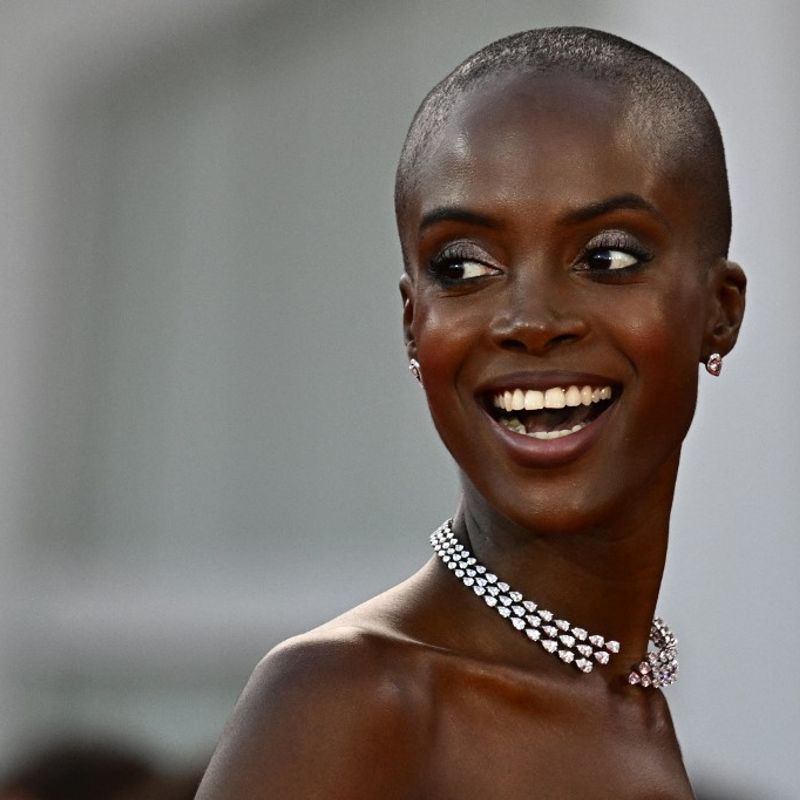 Model Madisin Rian, poses on the red carpet before the opening ceremony of the 80th International Venice Film Festival at Venice Lido. (Photo by GABRIEL BOUYS / AFP)