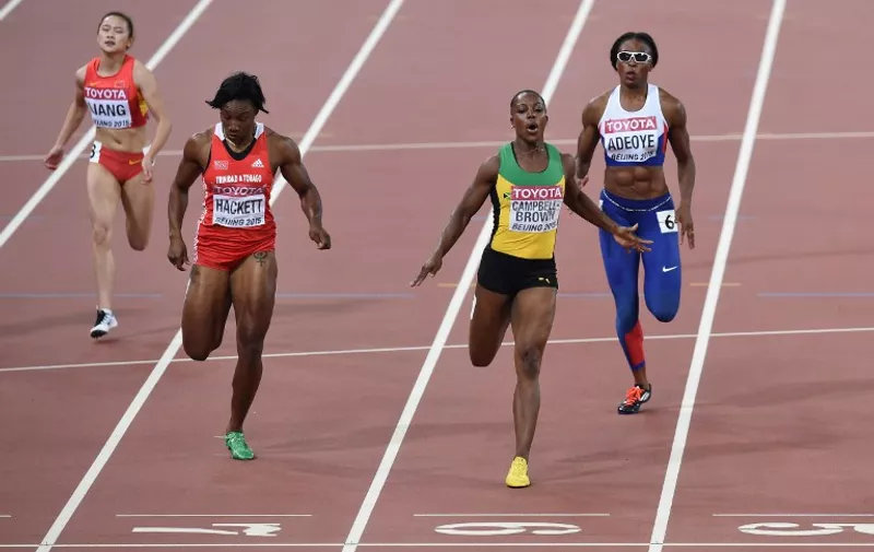 Jamaica's Veronica Campbell-Brown (2nd-R) runs in the same lane as Britain's Margaret Adeoye (R) next to Trinidad and Tobago's Semoy Hackett and China's Liang Xiaojing (L) during the women's 200 metres athletics event at the 2015 IAAF World Championships at the "Bird's Nest" National Stadium in Beijing on August 26, 2015.  AFP PHOTO / PEDRO UGARTE