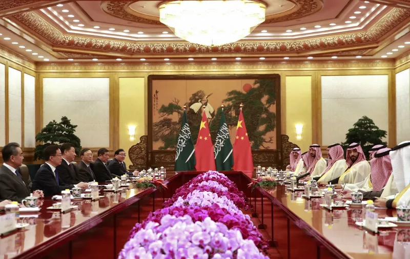 Saudi Crown Prince Mohammed bin Salman (4th R) attends a meeting with Chinese President Xi Jinping (3rd L) at the Great Hall of the People in Beijing on February 22, 2019. (Photo by HOW HWEE YOUNG / POOL / AFP)