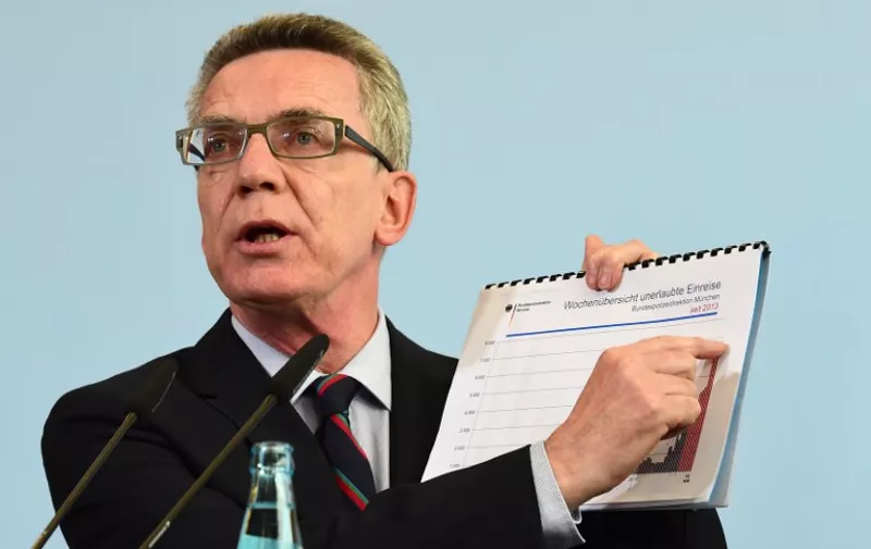 German Interior Minister Thomas de Maiziere delivers a statement on a forecast on the number of asylum seekers expected to arrive in Europe's biggest economy this year in Berlin, on August 19, 2015. Germany is expecting to receive  "up to 800,000" asylum seekers in 2015, a record figure, said de Maiziere. AFP PHOTO / JOHN MACDOUGALL