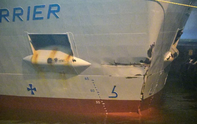 The British cargo ship Scot Carrier with damages to the bow has been towed at the port in Ystad, Sweden after colliding with the Danish cargo ship Karin Hoej in the early morning of December 13, 2021. - Sweden on December 13 arrested two people after a fatal early morning collision between a Danish and British ship off the southern Swedish coast, prosecutors said. Sweden's Prosecution Service said in a statement that an investigation into "aggravated drunkenness at sea," "gross negligence in sea traffic," and "gross causing of death by negligence" had been opened. One of those arrested was a British citizen born in 1991 and the other a Croatian citizen born in 1965, the Prosecution Service said. (Photo by Johan NILSSON / TT News Agency / AFP) / Sweden OUT