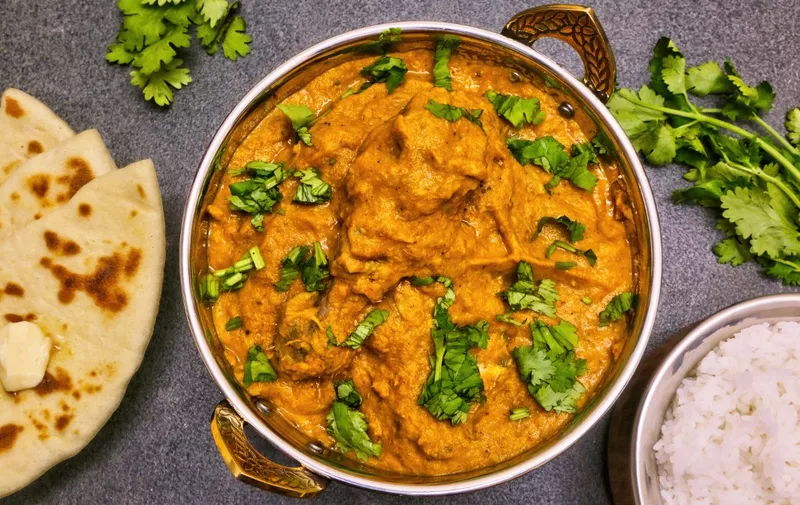 Butter chicken served with rice and butter naan bread in Toronto, Ontario, Canada, on February 06, 2021. (Photo by Creative Touch Imaging Ltd./NurPhoto) (Photo by Creative Touch Imaging Ltd / NurPhoto / NurPhoto via AFP)