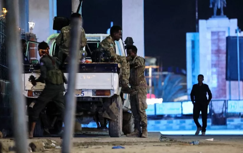 Security forces patrol near the Hayat Hotel after an attack by Al-Shabaab fighters in Mogadishu on August 20, 2022. - Al-Shabaab fighters attacked a hotel in the Somali capital Mogadishu in a hail of gunfire and explosions on August 19, 2022, with casualties reported, security sources and witnesses said. The assault on the Hayat Hotel triggered a fierce gunfight between security forces and gunmen from the jihadist group who are still holed up inside the building, security official Abdukadir Hassan told AFP. (Photo by Hassan Ali ELMI / AFP)