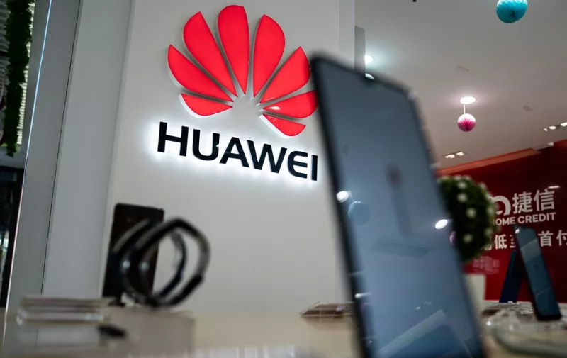A Huawei logo is displayed at a retail store in Beijing on May 20, 2019. - US internet giant Google, whose Android mobile operating system powers most of the world's smartphones, said it was beginning to cut ties with China's Huawei, which Washington considers a national security threat. (Photo by FRED DUFOUR / AFP)
