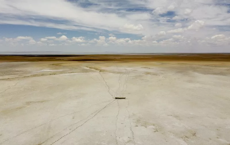 Aerial view of an abandoned boat on a desert at the site of former Lake Poopo, near Punaca Tinta Maria, Bolivia, taken on October 15, 2022. - Lake Poopo, once Bolivia's second-largest, has largely disappeared, taking with it a centuries-old culture reliant entirely on its bounty. (Photo by Martín SILVA / AFP)