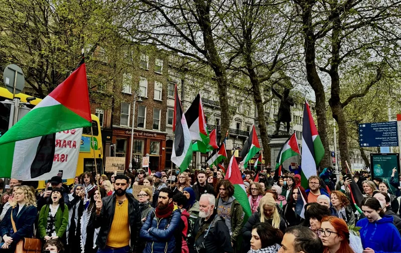 DUBLIN, IRELAND - MAY 04: People organize a pro-Palestinian protest outside Trinity College Dublin, ongoing simultaneously with pro-Palestinian student protests inside the college in Dublin, Ireland on May 04, 2024. The pro-Palestinian students protest, which started at around 21:00 yesterday evening, continues with approximately 73 students and 43 tents. Due to the protests, the university management closed its doors to the public. Trinity College announced the closure of the Book of Kells and the Old Library today due to the protest. Mostafa Darwish / Anadolu (Photo by MOSTAFA DARWISH / ANADOLU / Anadolu via AFP)