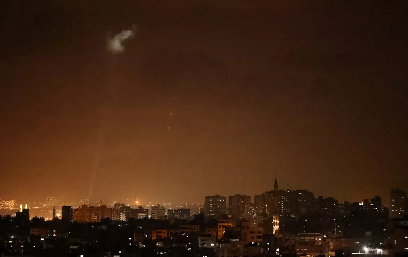 Shootings from the Palestinian territory light-up the night sky in Gaza city, on July 3, 2021, in response to the bombing of Israeli planes on Gaza military targets. - Israel attacked Gaza military targets late July 3, 2021, the army and Palestinian sources said, after incendiary balloons from the Palestinian territory caused fires in Israel in recent days. (Photo by MOHAMMED ABED / AFP)