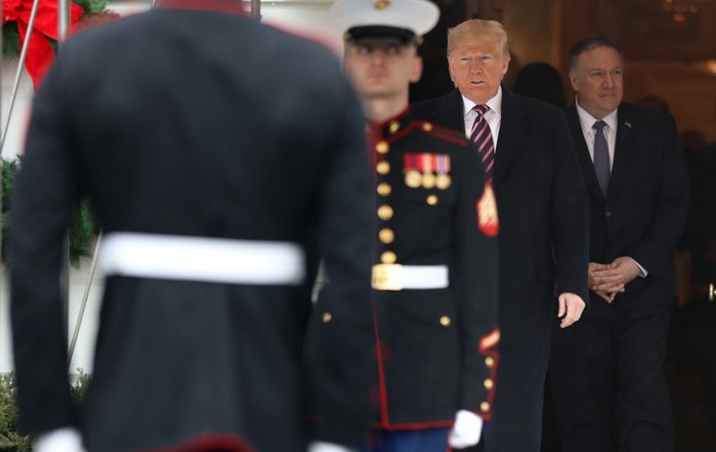 WASHINGTON, DC - DECEMBER 13: U.S. President Donald Trump and U.S. Secretary of State Mike Pompeo wait for the arrival of President of Paraguay Mario Abdo Benitez at the South Portico of the White House December 13, 2019 in Washington, DC. According to a White House news release, Benitezs visit focuses on strengthening cooperation between the United States and Paraguay to bring improved economic prosperity and support democracy in Paraguay and the region.   Alex Wong/Getty Images/AFP