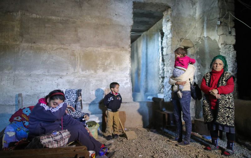 SHUSHI, NAGORNO-KARABAKH - OCTOBER 8, 2020: Local residents in a bomb shelter. The conflict between Armenia and Azerbaijan over Nagorno-Karabakh (Artsakh) escalated on September 27, 2020, with reports from Yerevan on the Azerbaijani troops advancing in the direction of Nagorno-Karabakh and shelling its settlements, including the capital city of Stepanakert. Both Azerbaijan and Armenia declared martial law and mobilized their armed forces, reporting on casualties and injuries among civilians as well. Sergei Bobylev/TASS,Image: 562083826, License: Rights-managed, Restrictions: , Model Release: no