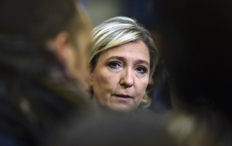 France's Front National (FN) far-right party's President and presidential candidate for the 2017 election Marine Le Pen speaks to a journalist at the Fermap manufacturing factory in Forbach, eastern France, on January 18, 2017.  / AFP PHOTO / PATRICK HERTZOG