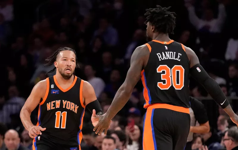 New York Knicks guard Jalen Brunson (11) celebrates scoring with forward Julius Randle (30) during the first half of an NBA basketball game against the Brooklyn Nets, Wednesday, March 1, 2023, in New York. (AP Photo/John Minchillo)