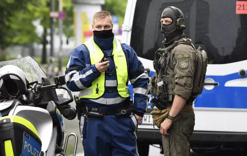 Police officers are seen guarding the Higher Regional Court in Frankfurt am Main on June 16, 2020 for the start of the trial of the accused of killing politician Walter Luebcke, who belonged to Chancellor Angela Merkel's conservative CDU party and headed the Kassel regional council in the western state of Hesse. - A German neo-Nazi stands trial Tuesday on charges of murdering pro-refugee politician Walter Luebcke, in a case that shocked the country and highlighted the growing threat of right-wing extremism. Federal prosecutors believe the main suspect, 46-year-old Stephan E, was motivated by "racism and xenophobia" when he allegedly drove to Luebcke's house on June 1, 2019 and shot him in the head. (Photo by THOMAS KIENZLE / AFP)