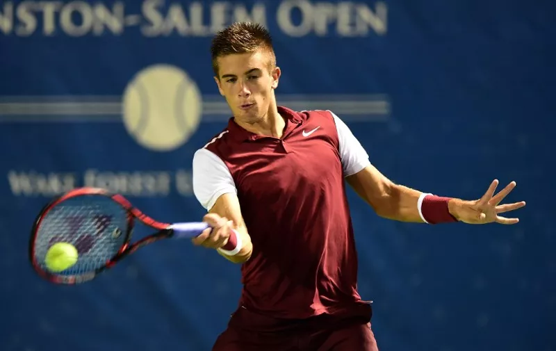 WINSTON-SALEM, NC - AUGUST 24: Borna Coric of Croatia returns a shot from Santiago Giraldo of Colombia during the first day of the Winston-Salem Open at Wake Forest University on August 24, 2015 in Winston-Salem, North Carolina.   Jared C. Tilton/Getty Images/AFP