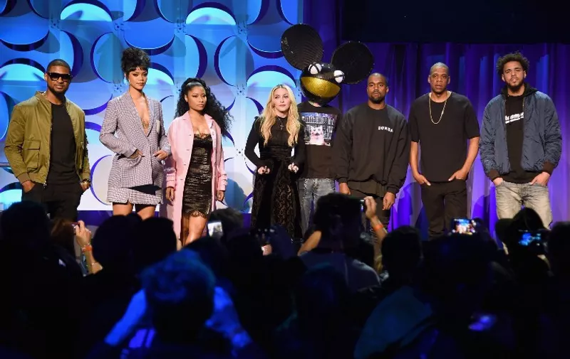 NEW YORK, NY - MARCH 30: (L-R) Usher, Rihanna, Nicki Minaj, Madonna, Deadmau5, Kanye West, JAY Z, and J. Cole onstage at the Tidal launch event #TIDALforALL at Skylight at Moynihan Station on March 30, 2015 in New York City.   Jamie McCarthy/Getty Images for Roc Nation/AFP
