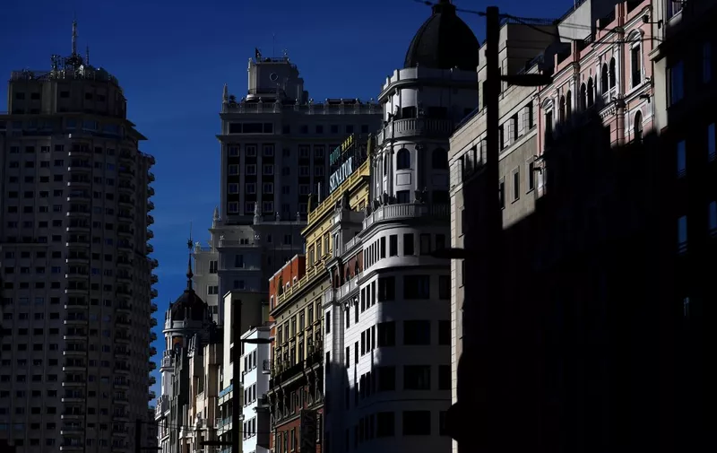 A general view shows some of the buildings on Gran Via, the main avenue of central Madrid, on October 16, 2020. - The coronavirus pandemic has pulverised Spain's tourism-dependent economy, with the government warning that GDP would fall by 11.2 percent this year, down from a previous prediction in May for a 9.2 percent decline. (Photo by GABRIEL BOUYS / AFP)