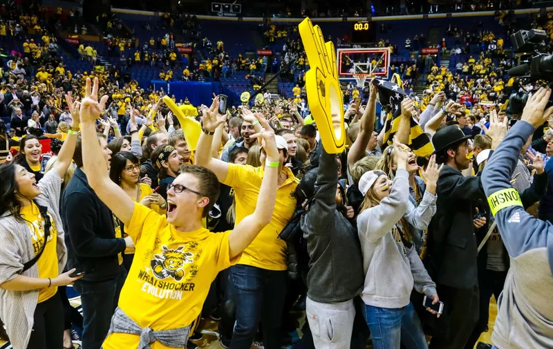 ST. LOUIS, MO &#8211; MARCH 05: Wichita State Shockers&#8217; fans react on the court after the Shockers&#8217; win during the second half of the MVC Championship final college basketball game between the Wichita State Shockers and the Illinois State Redbirds. The Wichita State Shockers defeated the Illinois State Redbirds 71-51 on March 5, 2017, at [&hellip;]