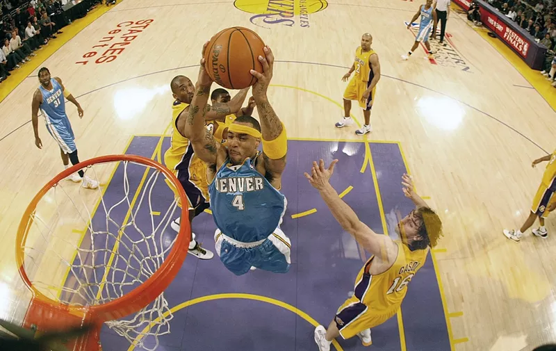LOS ANGELES, CA - MAY 21: Kenyon Martin #4 of the Denver Nuggets goes to the basket over Kobe Bryant #24 and Pau Gasol #16 in Game Five of the Western Conference Finals during the 2009 NBA Playoffs at Staples Center on May 27, 2009 in Los Angeles, California. NOTE TO USER: User expressly acknowledges and agrees that, by downloading and or using this photograph, User is consenting to the terms and conditions of the Getty Images License Agreement. (Photo by Harry How/Getty Images)