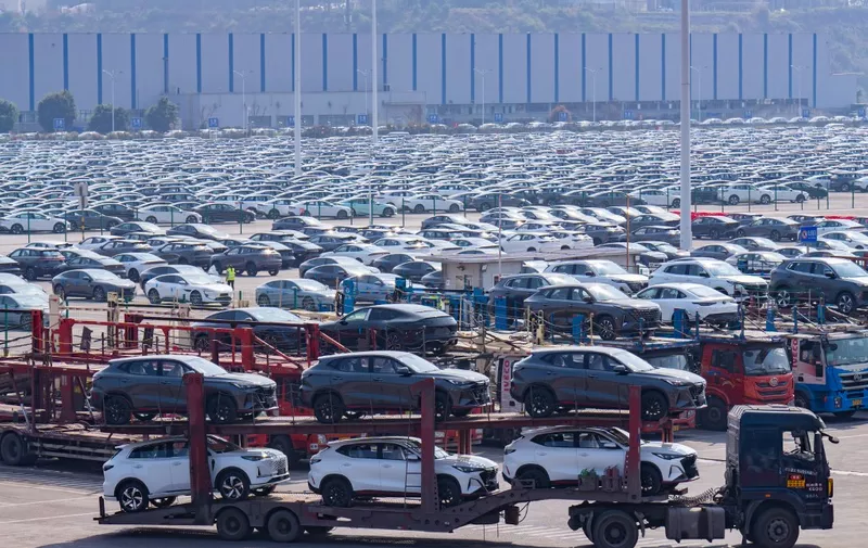 An aerial photo is showing new energy vehicles parked at Changan Automobile's vehicle distribution center in Chongqing, China, on March 11, 2024. From January to February 2024, the market share of new energy vehicles has reached 30%. In China, as the development of the new energy vehicle market becomes increasingly positive, several foreign enterprises are stating that they will continue to increase their investment in China. (Photo by Costfoto/NurPhoto) (Photo by CFOTO / NurPhoto / NurPhoto via AFP)