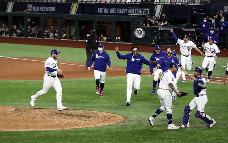 ARLINGTON, TEXAS - OCTOBER 27:  The Los Angeles Dodgers celebrate after defeating the Tampa Bay Rays 3-1 in Game Six to win the 2020 MLB World Series at Globe Life Field on October 27, 2020 in Arlington, Texas. (Photo by Ronald Martinez/Getty Images)