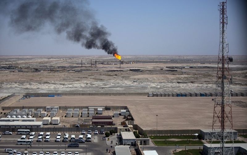 A picture taken on July 15, 2019 shows a partial view of the massive Majnoon oil field, some 40 kms from the eastern border with Iran, north of the Iraqi city of Basra. (Photo by Hussein FALEH / AFP)