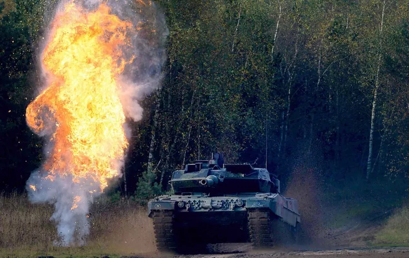 FILED - 10 October 2014, Lower Saxony, Bergen: A Leopard 2A6 tank drives through the terrain during the "Land Operations" information training exercise. Germany plans to deliver 14 Leopard 2A6 main battle tanks from Bundeswehr stocks to Ukraine as a first step. This was announced by government spokesman Hebestreit in a statement on Wednesday. Photo: picture alliance / dpa (Photo by Peter Steffen / DPA / dpa Picture-Alliance via AFP)